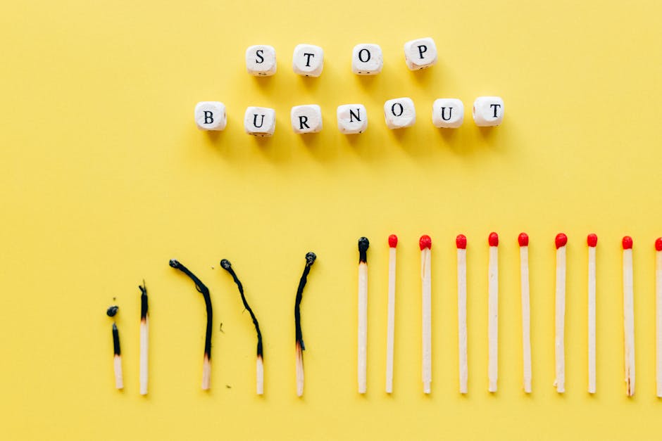 pexels-photo-6837572-6837572 Conceptual image of burnout prevention with matches and letters on yellow background.