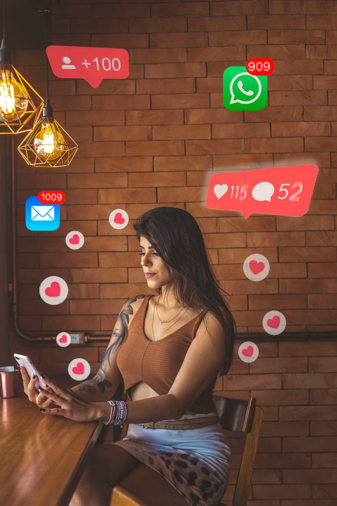 pexels-photo-2055500-2055500 Woman using smartphone in cafe with social media notifications around.